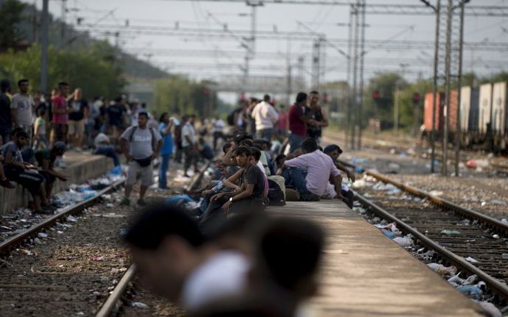 Migrants wait for a train at Gevgelija train station in Macedonia, close to the border with Greece, August 14, 2015. In the past month, an estimated 30,000 refugees have passed through Macedonia, another step in their uncertain search for a better life in western Europe. REUTERS/Stoyan Nenov Migrants wait for a train at Gevgelija train station in Macedonia, close to the border with Greece, August 14, 2015. In the past month, an estimated 30,000 refugees have passed through Macedonia, another step in their uncertain search for a better life in western Europe. REUTERS/Stoyan Nenov