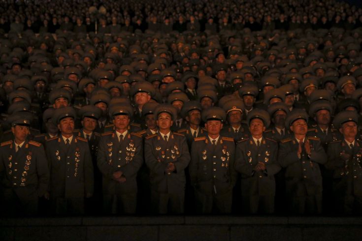 Senior North Korean military officers are lit by light from torches as they follow the performance on Pyongyang's main Kim Il Sung Square celebrating the 70th anniversary of the founding of the ruling Workers' Party of Korea October 10, 2015. Isolated North Korea marked the 70th anniversary of its ruling Workers' Party on Saturday with a massive military parade overseen by leader Kim Jong Un, who said his country was ready to fight any war waged by the United States. REUTERS/Damir Sagolj Senior North Korean military officers are lit by light from torches as they follow the performance on Pyongyang's main Kim Il Sung Square celebrating the 70th anniversary of the founding of the ruling Workers' Party of Korea October 10, 2015. Isolated North Korea marked the 70th anniversary of its ruling Workers' Party on Saturday with a massive military parade overseen by leader Kim Jong Un, who said his country was ready to fight any war waged by the United States. REUTERS/Damir Sagolj