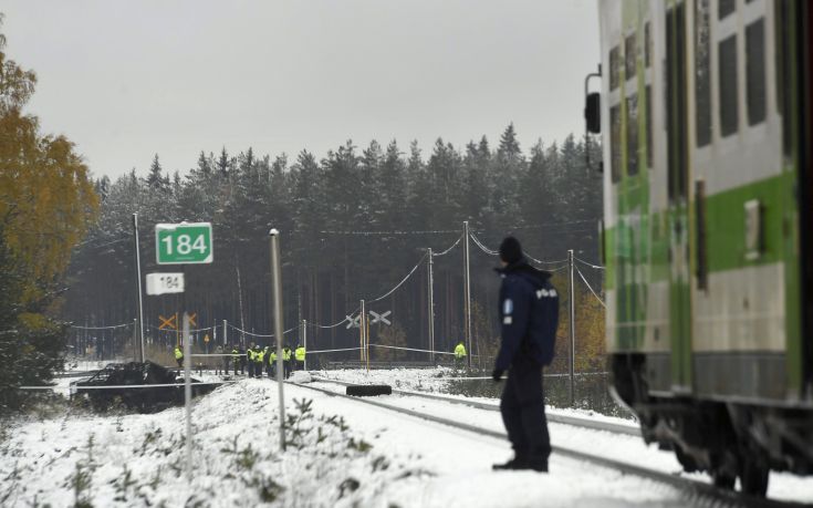 Rescue, military personnel and a policeman gather at the railroad crossing, where several people were killed in a crash between a train, right, and a military truck, left, by the track, in southern Finland Thursday Oct. 26, 2017. Finnish media say several people have been killed in a train crash in the southern part of Finland. (Lehtikuva via AP) Rescue, military personnel and a policeman gather at the railroad crossing, where several people were killed in a crash between a train, right, and a military truck, left, by the track, in southern Finland Thursday Oct. 26, 2017. Finnish media say several people have been killed in a train crash in the southern part of Finland. (Lehtikuva via AP)