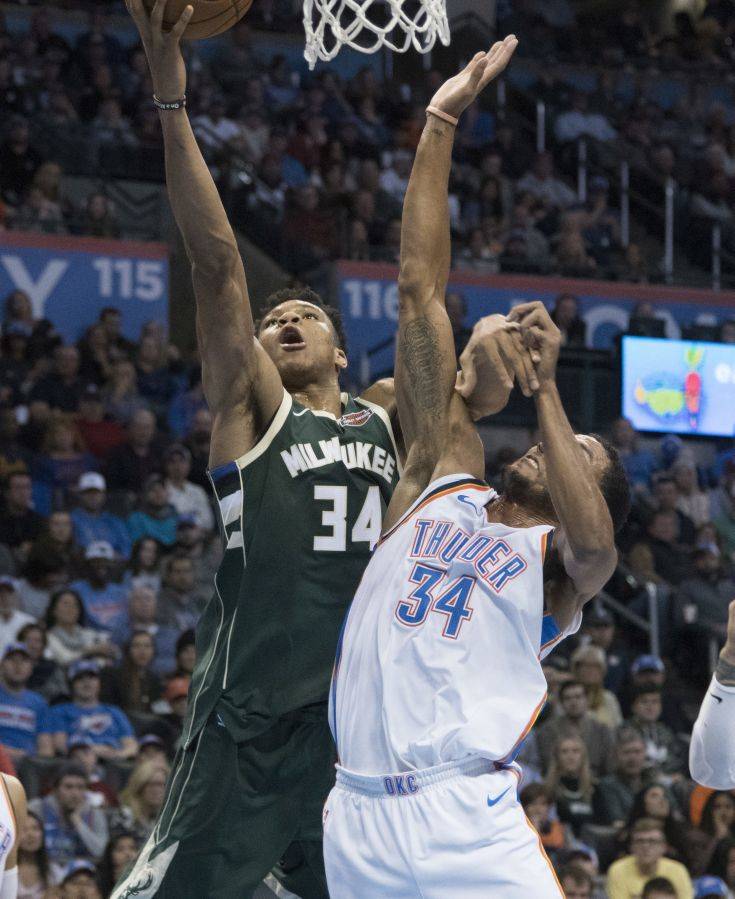 Milwaukee Bucks forward Giannis Antetokounmpo (34) and Oklahoma City Thunder forward Josh Huestis (34) battle for the ball during the first half of an NBA basketball game in Oklahoma City, Friday, Dec. 29, 2017. (AP Photo/J Pat Carter) Milwaukee Bucks forward Giannis Antetokounmpo (34) and Oklahoma City Thunder forward Josh Huestis (34) battle for the ball during the first half of an NBA basketball game in Oklahoma City, Friday, Dec. 29, 2017. (AP Photo/J Pat Carter)