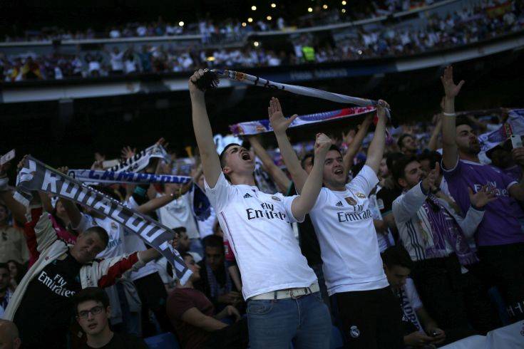 Real Madrid supporters watch on the big screens placed at the team's Santiago Bernabeu stadium as their team play, during theChampions League final match between Real Madrid and Liverpool being played in Kiev, Ukraine, in Madrid, Saturday, May 26, 2018. (AP Photo/Francisco Seco) Real Madrid supporters watch on the big screens placed at the team's Santiago Bernabeu stadium as their team play, during theChampions League final match between Real Madrid and Liverpool being played in Kiev, Ukraine, in Madrid, Saturday, May 26, 2018. (AP Photo/Francisco Seco)