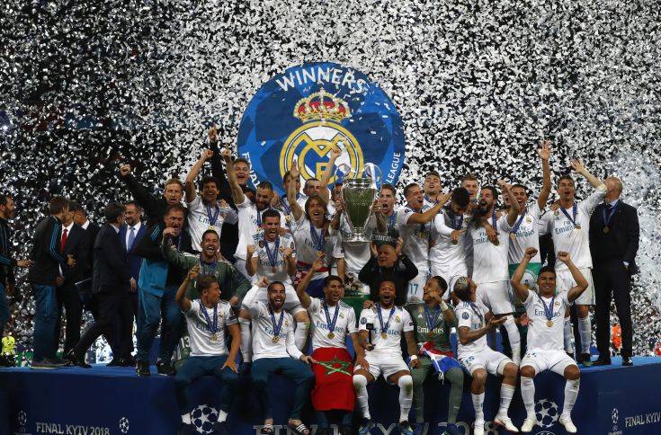 Real Madrid players celebrate with trophy after winning the Champions League Final soccer match between Real Madrid and Liverpool at the Olimpiyskiy Stadium in Kiev, Ukraine, Saturday, May 26, 2018. (AP Photo/Matthias Schrader) Real Madrid players celebrate with trophy after winning the Champions League Final soccer match between Real Madrid and Liverpool at the Olimpiyskiy Stadium in Kiev, Ukraine, Saturday, May 26, 2018. (AP Photo/Matthias Schrader)