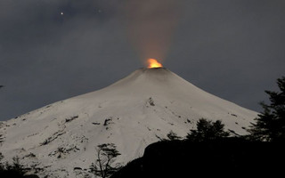 Smoke rises from Villarrica volcano as seen near the town of Pucon in southern Chile, June 23, 2015. REUTERS/Andres Stapff