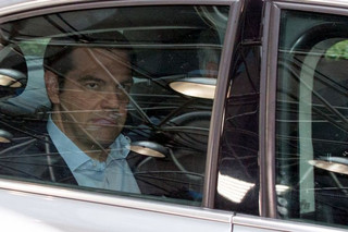 Greek Prime Minister Alexis Tsipras arrives in his car at a euro zone leaders summit in Brussels, Belgium, July 12, 2015. Euro zone leaders will fight to the finish to keep near-bankrupt Greece in the euro zone on Sunday after the European Union's chairman cancelled a planned summit of all 28 EU leaders that would have been needed in case of a "Grexit". REUTERS/Philippe Wojazer