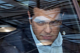 Greek Prime Minister Alexis Tsipras arrives in his car at a euro zone leaders summit in Brussels, Belgium, July 12, 2015. Euro zone leaders will fight to the finish to keep near-bankrupt Greece in the euro zone on Sunday after the European Union's chairman cancelled a planned summit of all 28 EU leaders that would have been needed in case of a "Grexit". REUTERS/Philippe Wojazer      TPX IMAGES OF THE DAY
