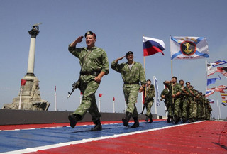 Russian servicemen march during celebrations for Navy Day in the Black Sea port of Sevastopol