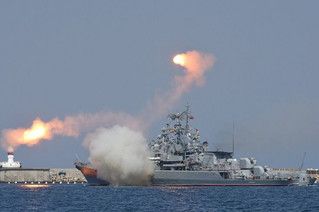 A Russian warship fires during celebrations for Navy Day in the Black Sea port of Sevastopol