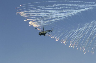 A Russian military helicopter flies during celebrations for Navy Day in the Black Sea port of Sevastopol