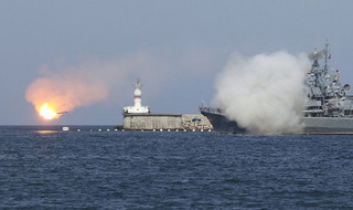 A Russian warship fires during celebrations for Navy Day in Sevastopol