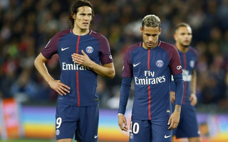 Paris Saint Germain's Edinson Cavani, left, and Neymar look on prior to shoot a free kick during their French League One soccer match between PSG and Olympique Lyon at the Parc des Princes stadium in Paris, France, Sunday, Sept. 17, 2016. (AP Photo/Francois Mori)