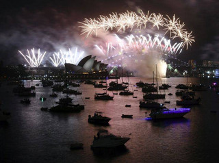 Fireworks explode over Sydney Harbour during New Year's Eve celebrations in Sydney, Monday, Jan. 1, 2018. (David Moir/AAP Image via AP)