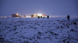 In this photo provided by the Russian Ministry for Emergency Situations RMES employees work at the scene of a AN-148 plane crash in Stepanovskoye village, about 40 kilometers (25 miles) from the Domodedovo airport, Moscow, Russia, Sunday, Feb. 11, 2018. The Saratov Airlines regional jet disappeared from radar screens a few minutes after departing from Domodedovo Airport en route to Orsk, a city some 1,500 kilometers (1,000 miles) southeast of Moscow. Russian officials say all passengers aboard the airliner are believed to have been residents of the region that was the plane's destination. No survivors have been reported. (Russian Ministry for Emergency Situations photo via AP)