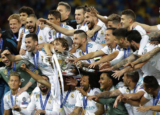 Real Madrid players celebrate with the trophy after winning the Champions League Final soccer match between Real Madrid and Liverpool at the Olimpiyskiy Stadium in Kiev, Ukraine, Saturday, May 26, 2018. (AP Photo/Sergei Grits)