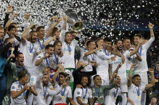 Real Madrid's Sergio Ramos lifts the trophy during the Champions League Final soccer match between Real Madrid and Liverpool at the Olimpiyskiy Stadium in Kiev, Ukraine, Saturday, May 26, 2018. (AP Photo/Efrem Lukatsky)