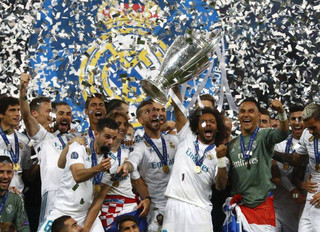 Real Madrid players celebrate with the trophy after winning the Champions League Final soccer match between Real Madrid and Liverpool at the Olimpiyskiy Stadium in Kiev, Ukraine, Saturday, May 26, 2018. (AP Photo/Matthias Schrader)