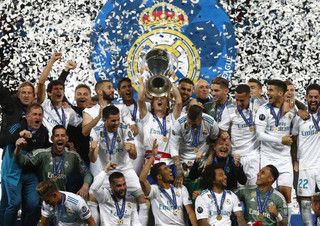 Real Madrid players celebrate with the trophy after winning the Champions League Final soccer match between Real Madrid and Liverpool at the Olimpiyskiy Stadium in Kiev, Ukraine, Saturday, May 26, 2018. (AP Photo/Matthias Schrader)